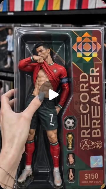AI-generated unboxing still: a hyperreal Ronaldo 'Record Breaker' collector figure in blister packaging, Instant Studio logomark printed on the box